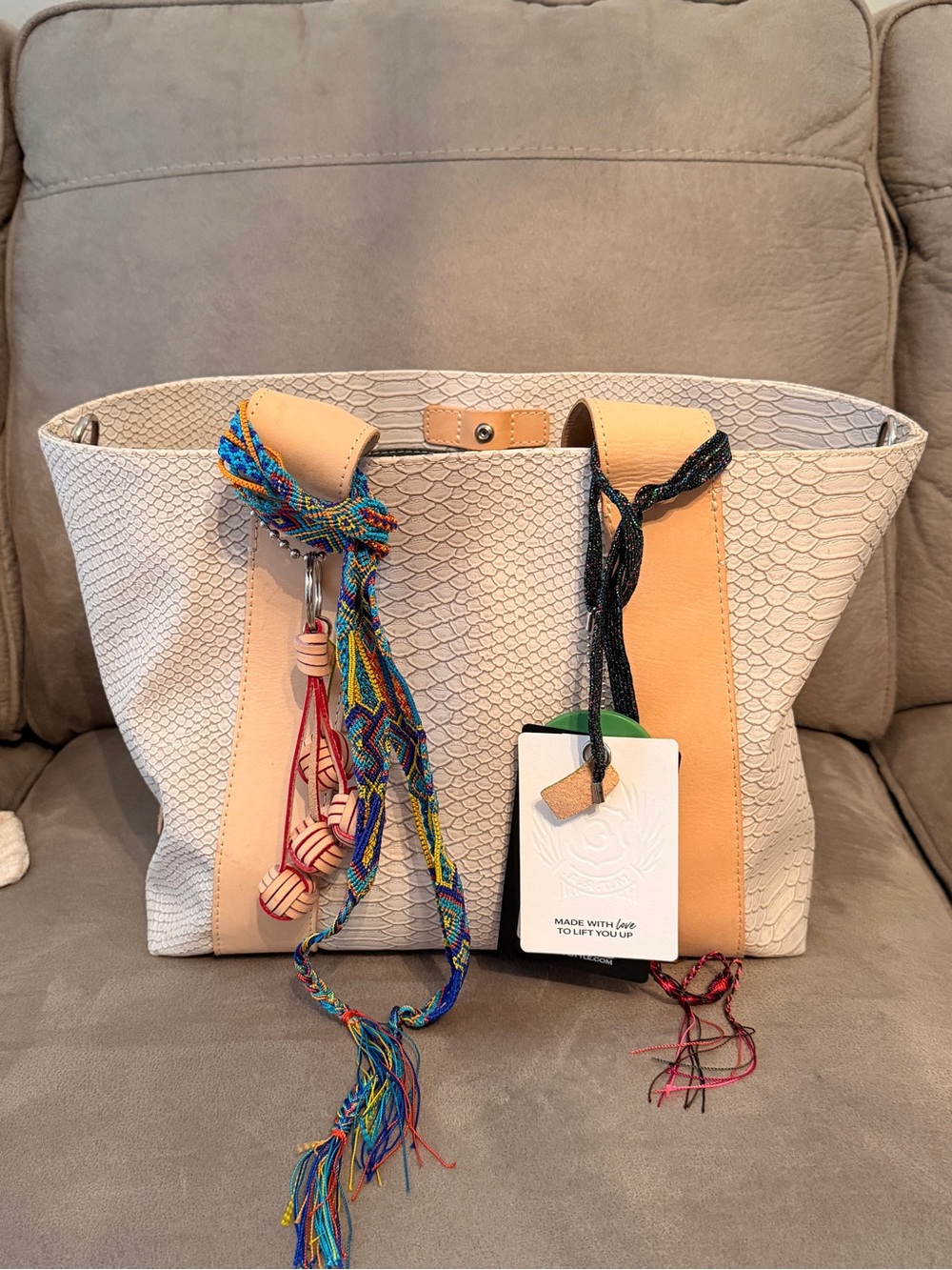 Consuela Thunderbird Carryall Cream Textured Tote with Tan Straps and Red Tassel - Picture 2 of 5